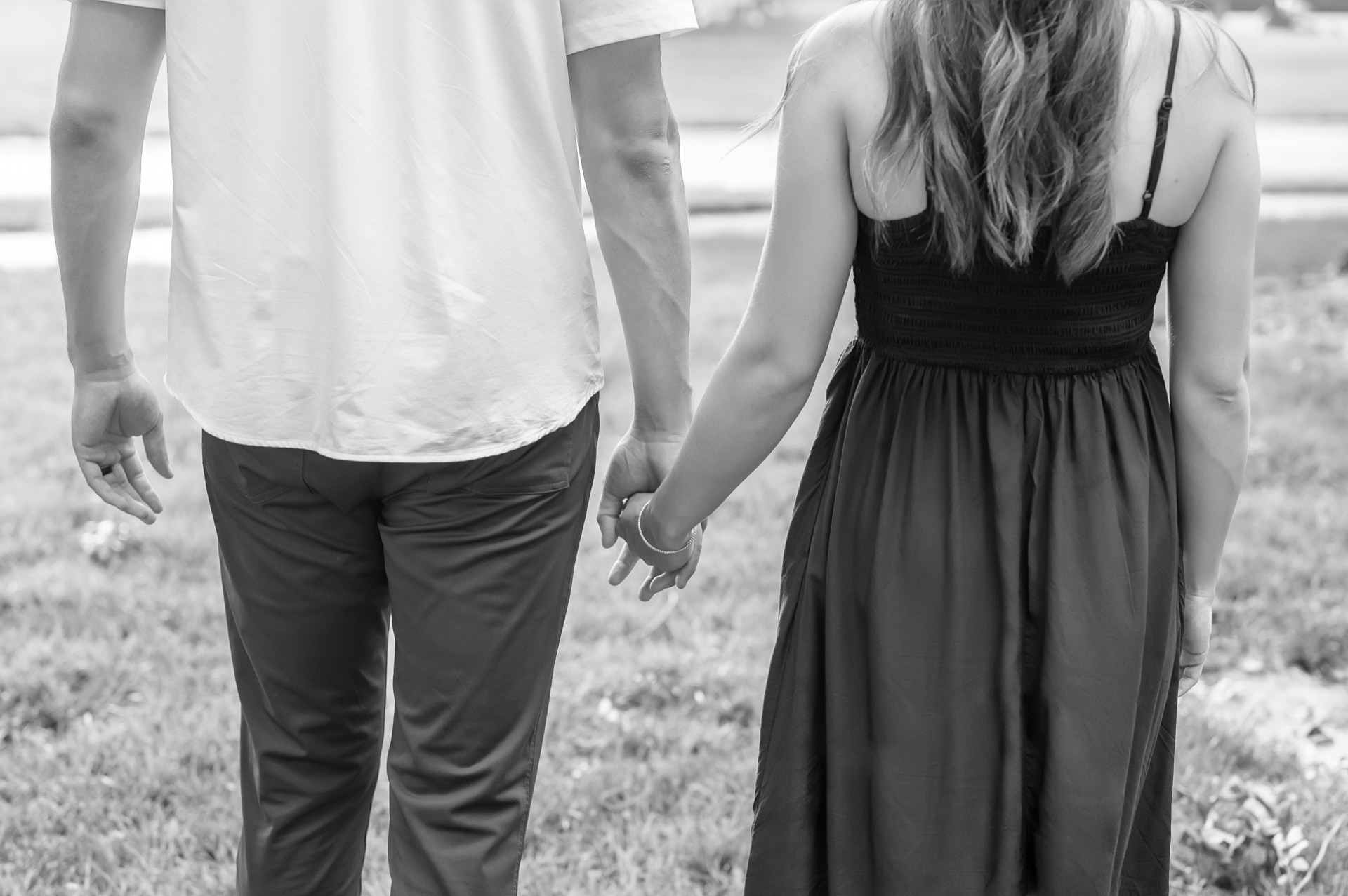 Couple holding hands, walking together
