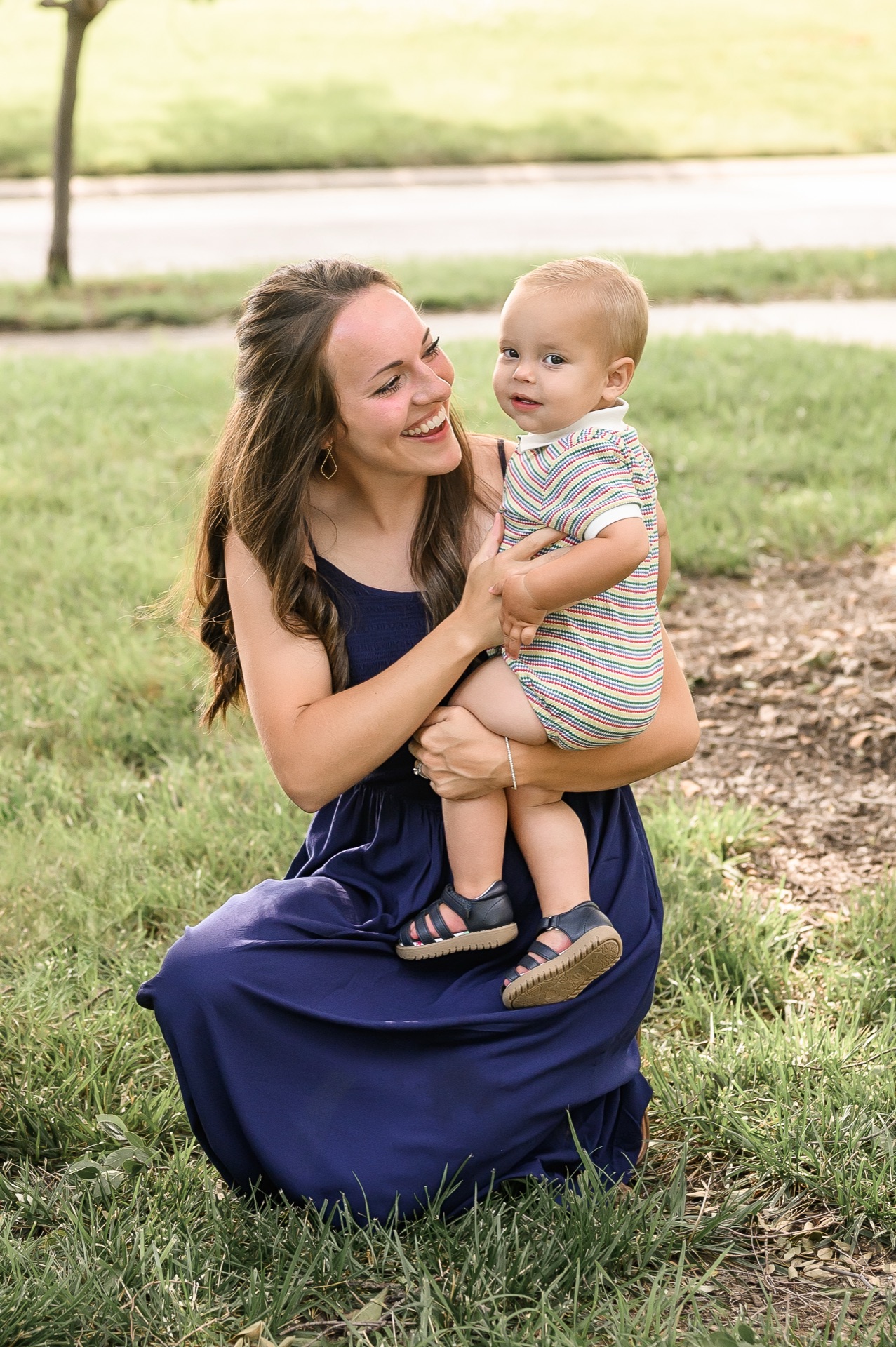 Mother holding baby in a park