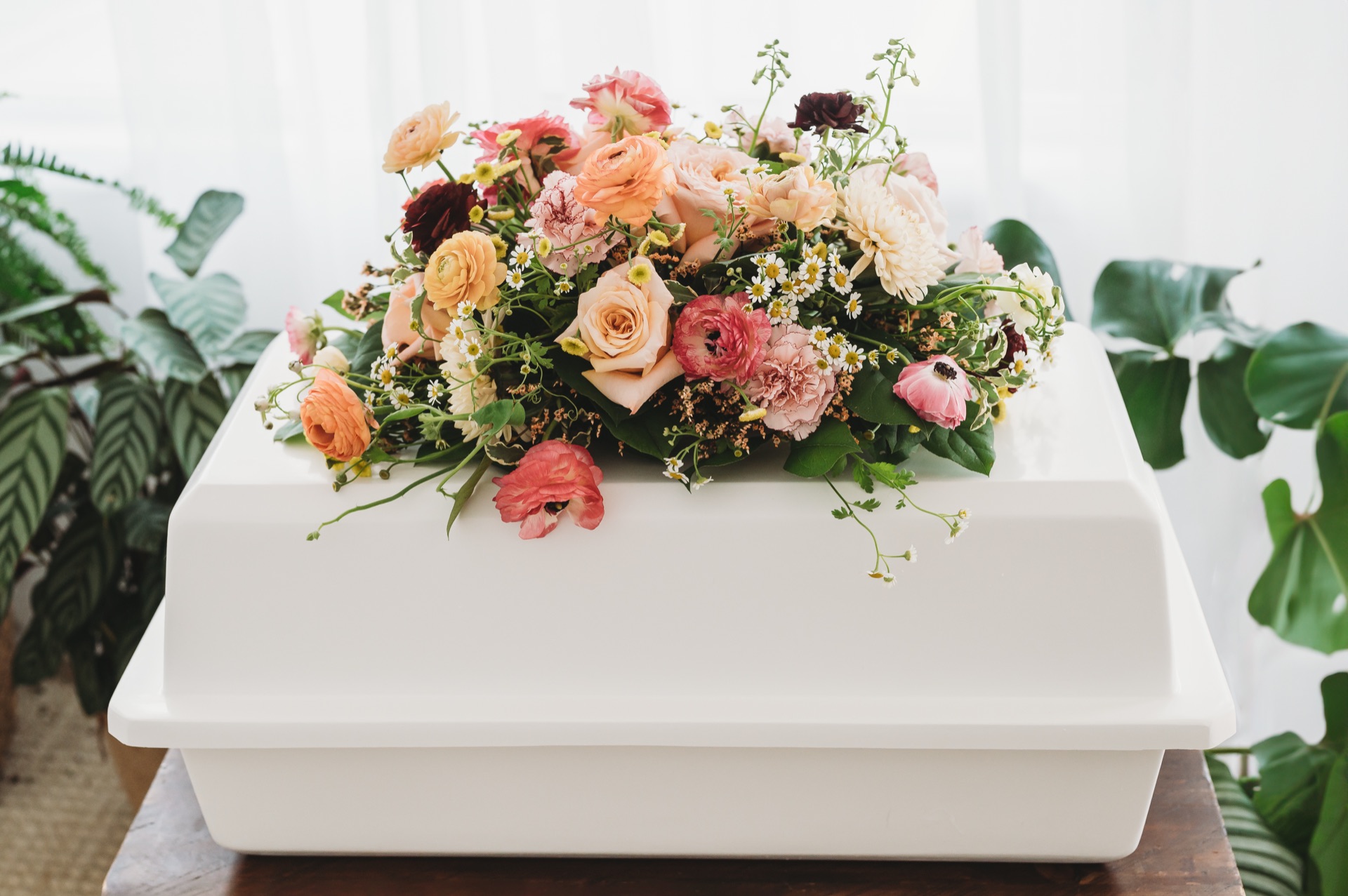 Floral arrangement on casket