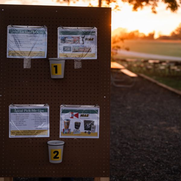 Bulletin_board_with_papers_posted_at_sunset