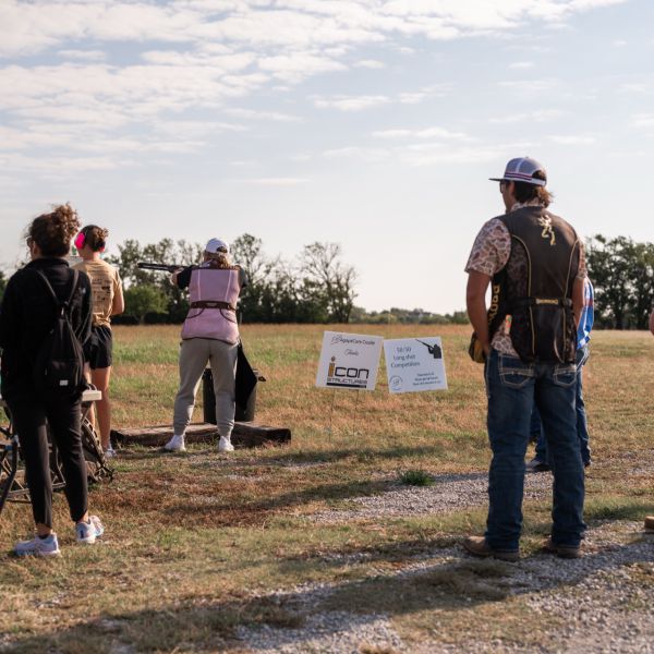 Group_of_hunters_with_clay_gathered_at_outdoor_event