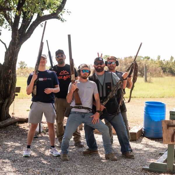 Group_of_men_ready_for_clay_at_shooting_range