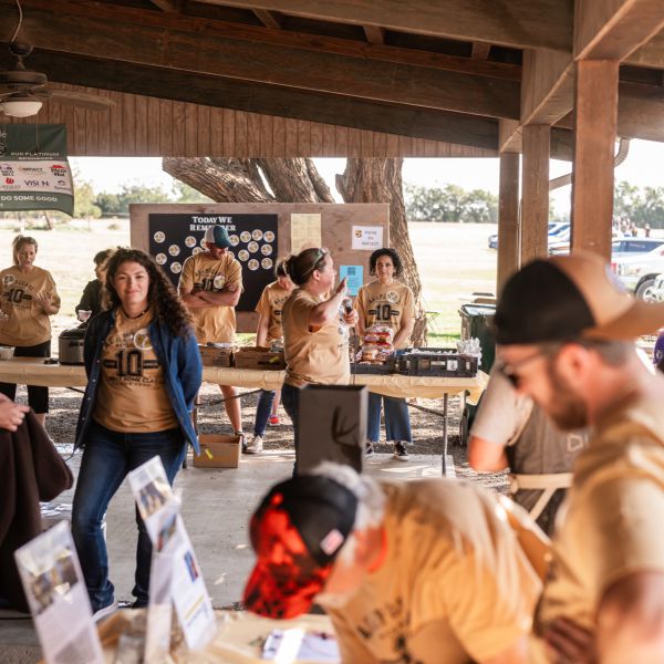Group_of_people_gathered_under_pavilion_at_sscdsg