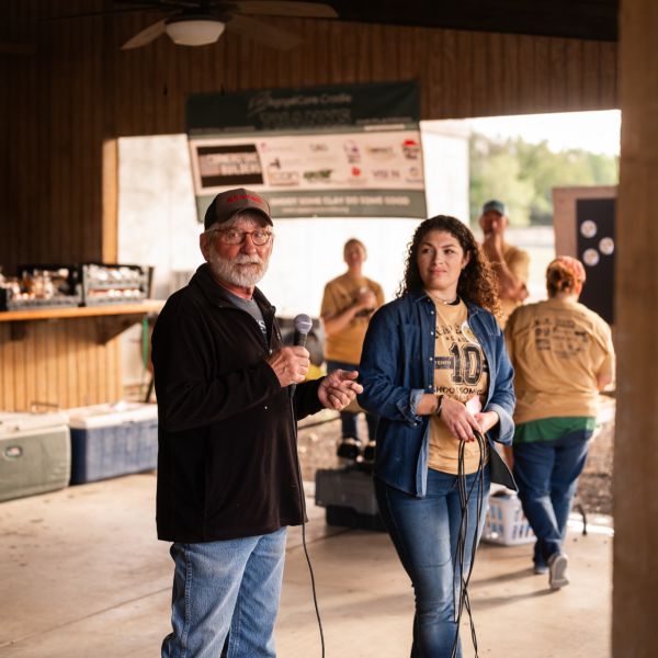 Man_and_woman_standing_outside_talking