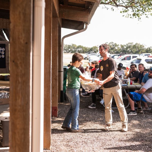 Man_receiving_raffle_prize