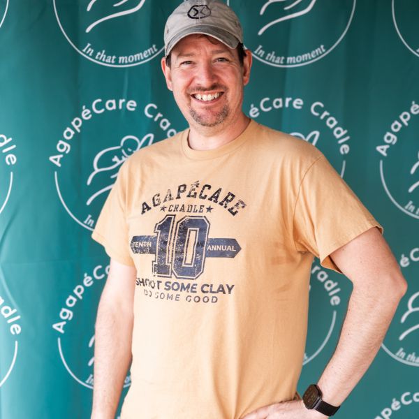 Man_smiling_with_hands_on_hips