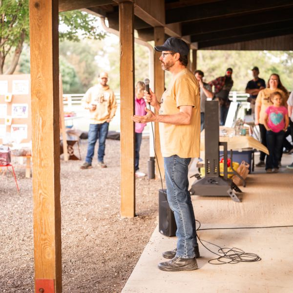 Man_speaking_to_group_at_sscdsg_pavilion