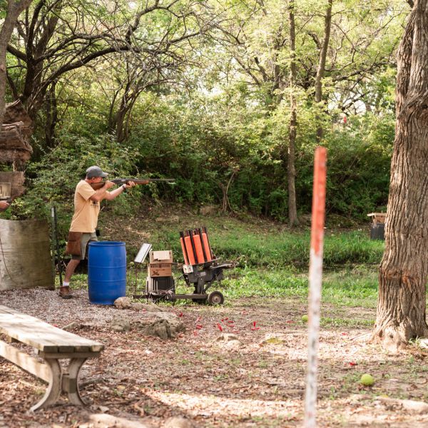 Men_practicing_shooting_at_an_outdoor_range