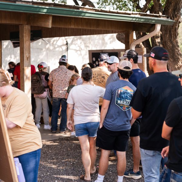 People_gathered_under_pavilion_outside