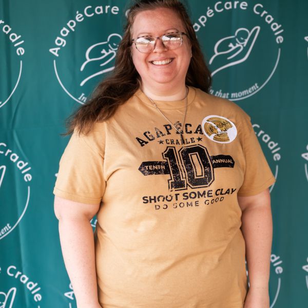 Woman_at_banner_backdrop_smiling