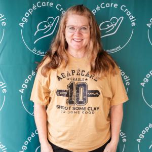 Woman_in_Yellow_Tshirt_smiling_at_camera